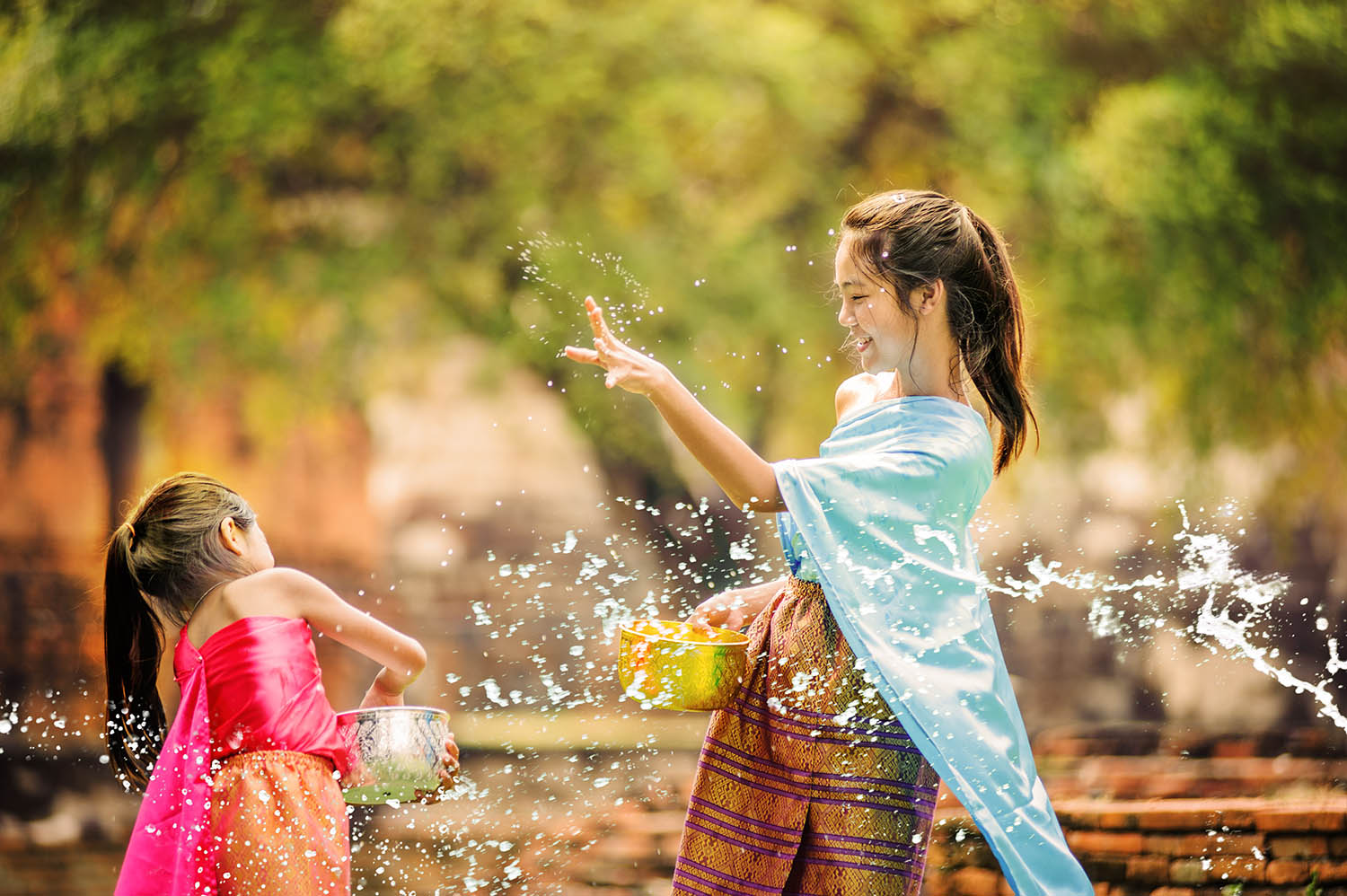 Thai Girls Playing With Water