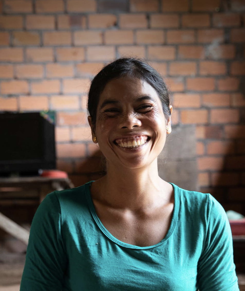 Woman Of Colour Smiling At Camera
