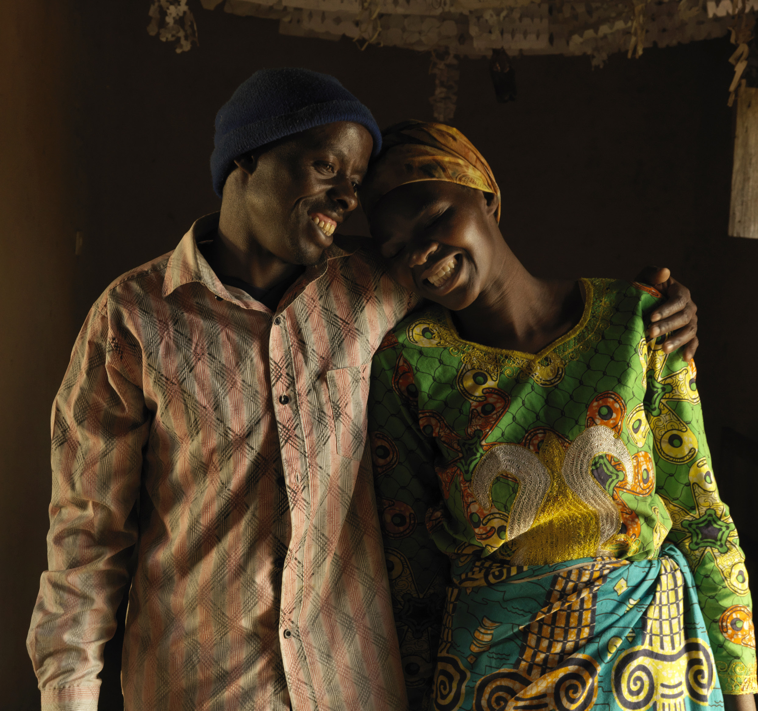 African Man And Woman Cuddling And Smiling
