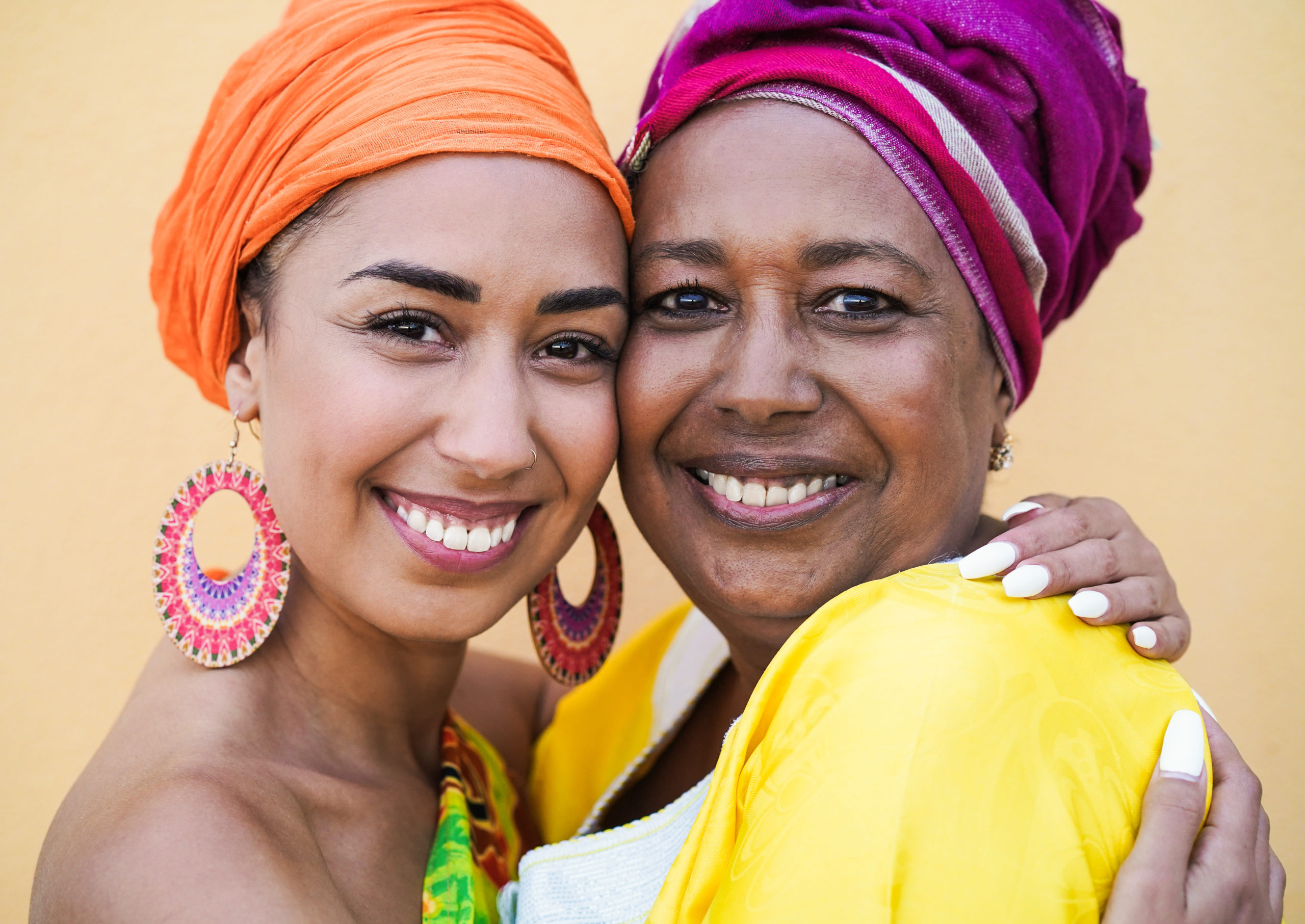 Black Mother And Daughter Smiling And Hugging