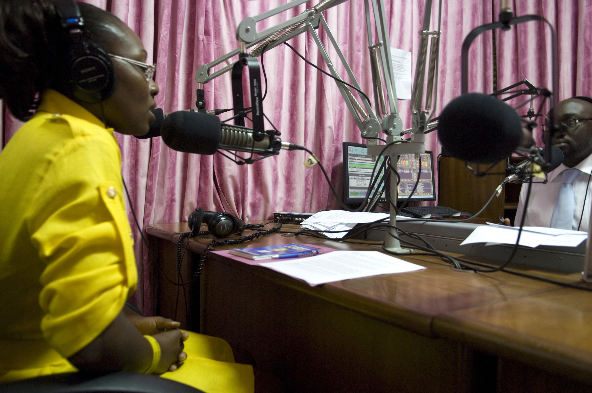 African Woman Speaking At A Radio Sound Booth